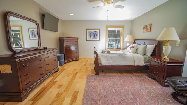 bedroom featuring recessed lighting, light wood-style flooring, and a ceiling fan