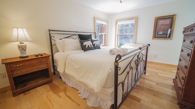 bedroom featuring light wood-style flooring