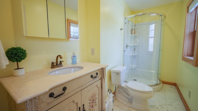 bathroom featuring marble finish floor, a stall shower, toilet, and baseboards