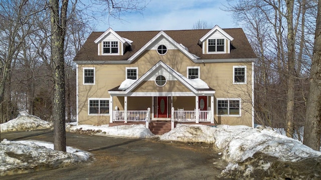 shingle-style home with covered porch