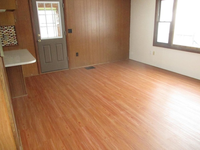 54 Plane View Rd, Morristown, VT 05661 - unfurnished living room with wood finished floors and wood walls
