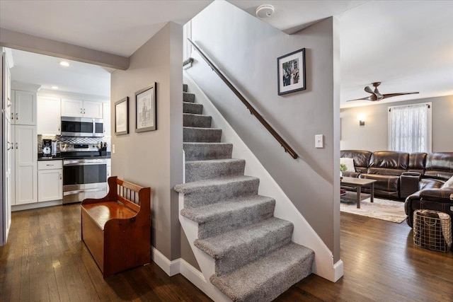 stairway with recessed lighting, baseboards, ceiling fan, and hardwood / wood-style flooring