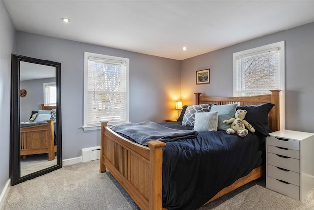 bedroom featuring a baseboard heating unit, recessed lighting, baseboards, and light carpet