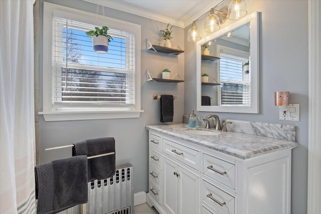 full bathroom featuring radiator, ornamental molding, and vanity