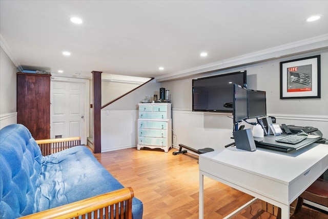 home office with recessed lighting, a wainscoted wall, light wood-style floors, and ornamental molding