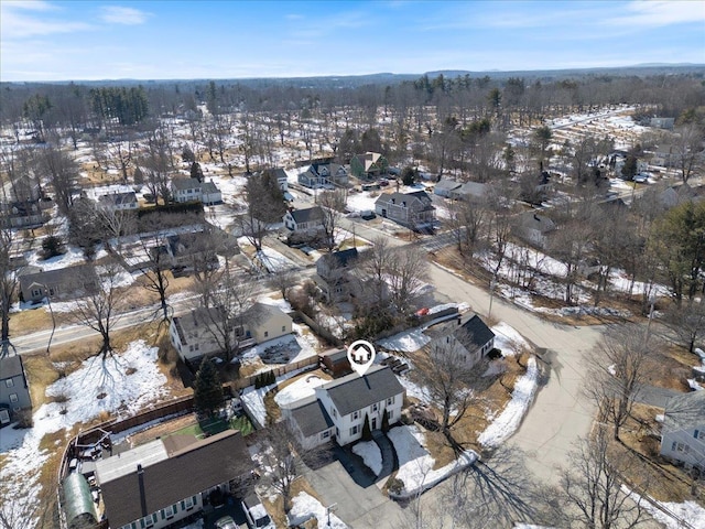 snowy aerial view with a residential view