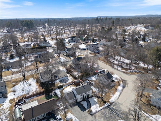 snowy aerial view featuring a residential view