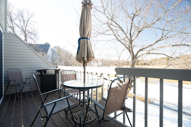 wooden deck with outdoor dining space