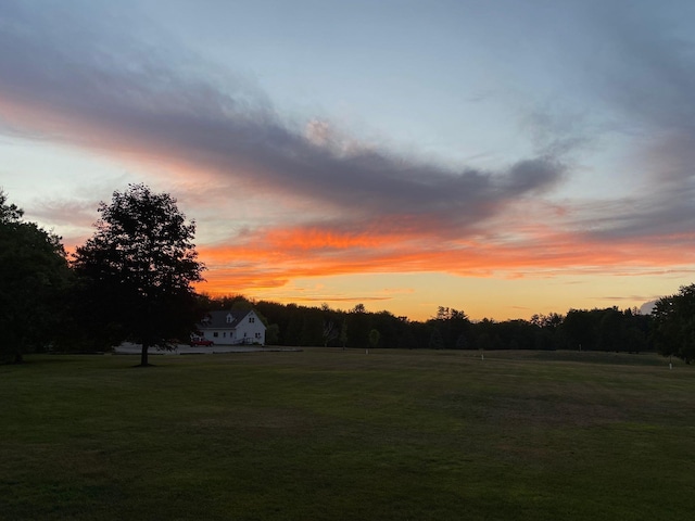 yard at dusk with a rural view