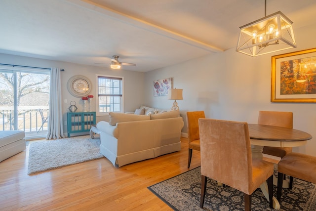 dining space with light wood-style floors and a ceiling fan