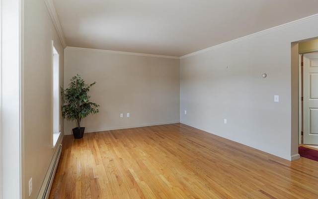 unfurnished room featuring crown molding, light wood-type flooring, baseboards, and a baseboard radiator