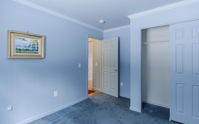 unfurnished bedroom with a closet, baseboards, carpet, and ornamental molding