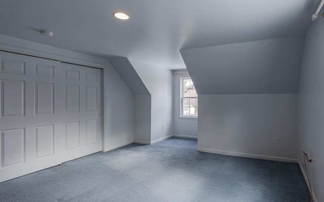 bonus room featuring lofted ceiling, baseboards, and carpet floors