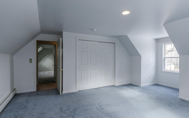 bonus room with lofted ceiling, baseboards, a baseboard heating unit, and carpet