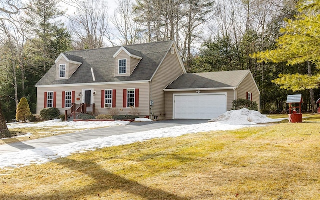 cape cod house featuring a garage, driveway, and a front lawn