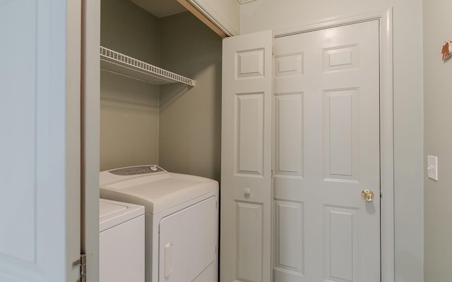 washroom featuring washer and dryer and laundry area