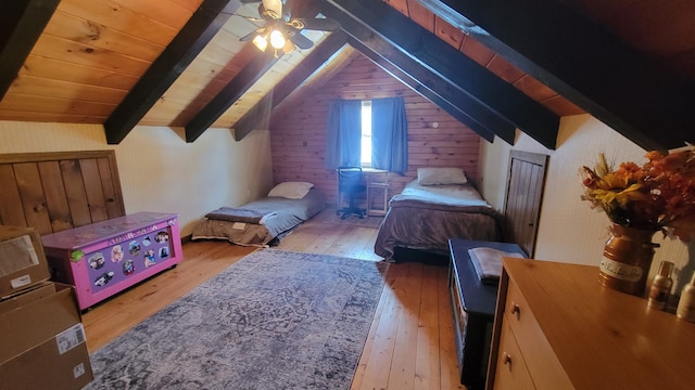 bedroom featuring hardwood / wood-style floors, lofted ceiling with beams, wood ceiling, and ceiling fan