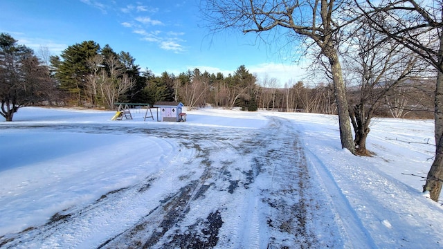 yard covered in snow featuring playground community