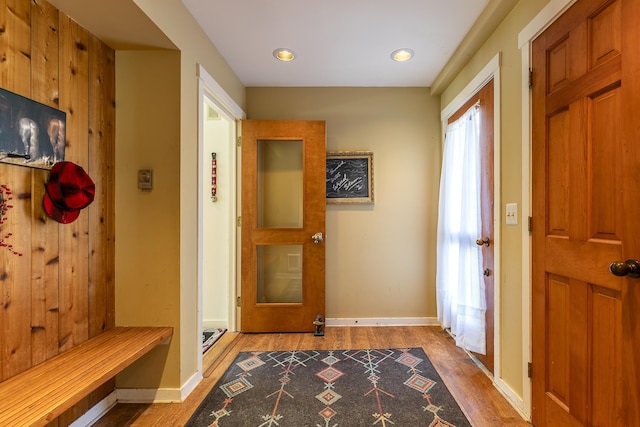 mudroom featuring baseboards and wood finished floors