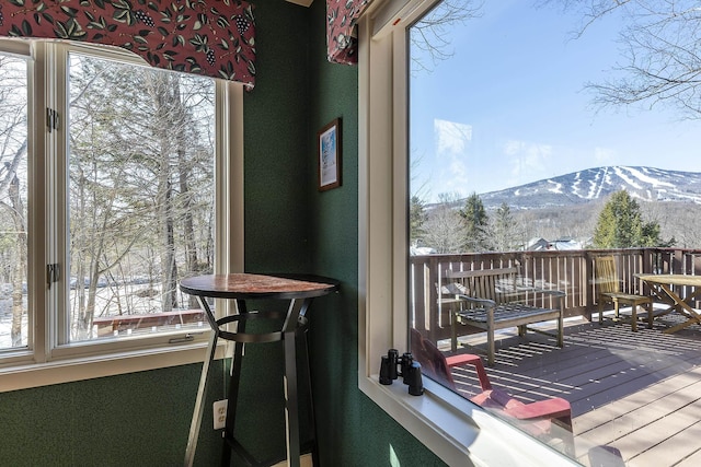 wooden deck featuring a mountain view