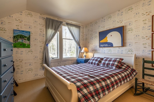 bedroom with wallpapered walls, carpet, and lofted ceiling