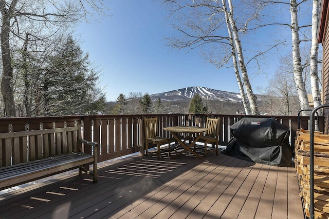 wooden terrace with a mountain view and grilling area