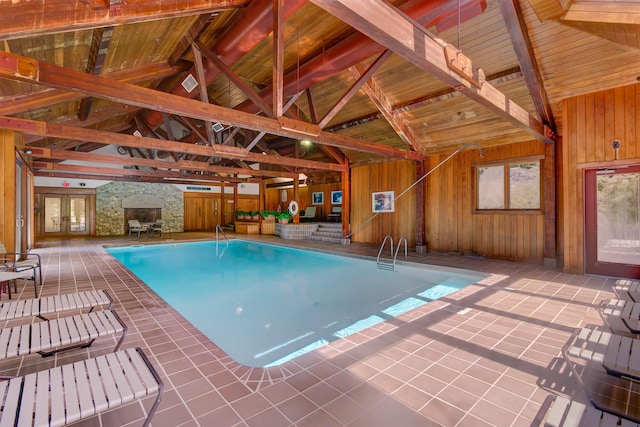 indoor pool featuring a patio area and french doors