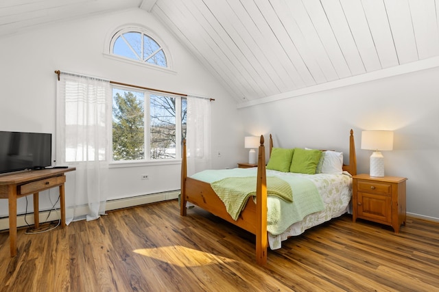 bedroom with a baseboard heating unit, wood finished floors, and high vaulted ceiling