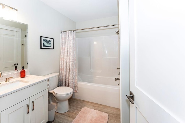 full bathroom with toilet, vanity, shower / tub combo with curtain, and wood finished floors