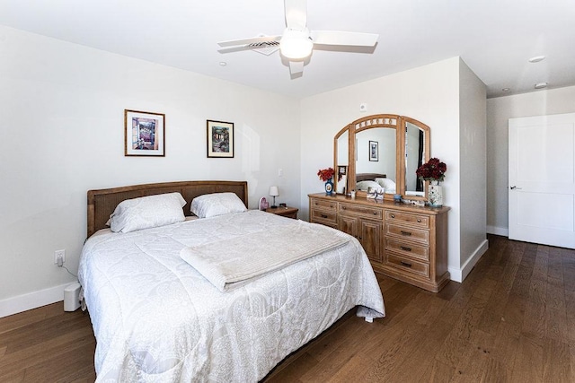 bedroom featuring ceiling fan, baseboards, and dark wood-style floors