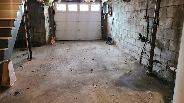 garage with concrete block wall