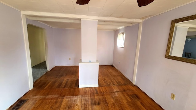 unfurnished room featuring wood finished floors and visible vents