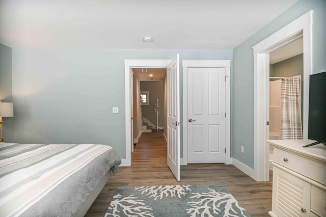 bedroom with baseboards and light wood-style flooring