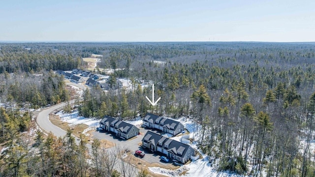 birds eye view of property with a view of trees