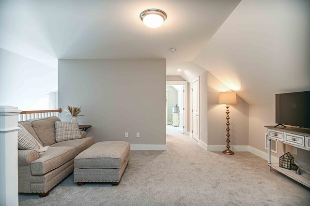 interior space featuring baseboards and lofted ceiling