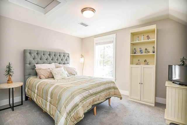 bedroom featuring visible vents, light carpet, and baseboards