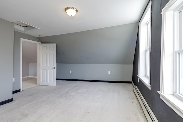 bonus room with attic access, baseboards, and a wealth of natural light