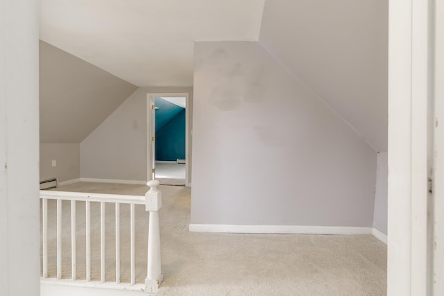 bonus room with vaulted ceiling, carpet, baseboards, and baseboard heating