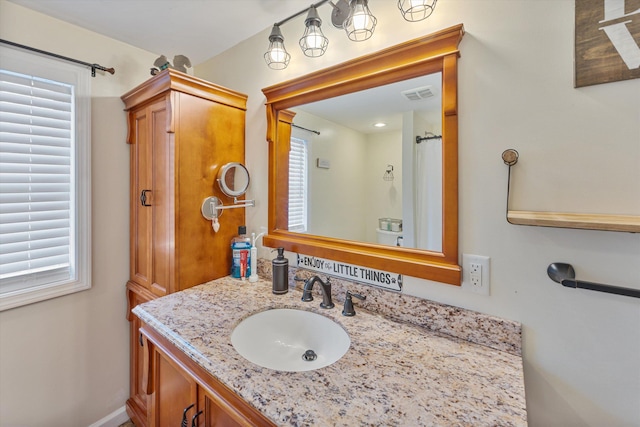 bathroom featuring visible vents and vanity