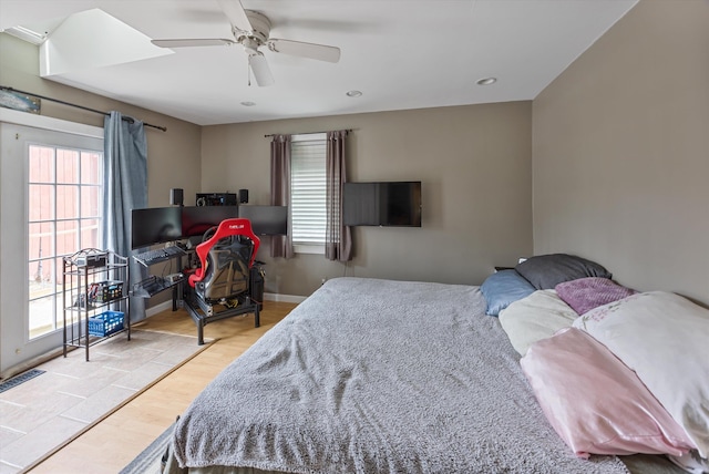 bedroom featuring a ceiling fan, visible vents, wood finished floors, baseboards, and recessed lighting