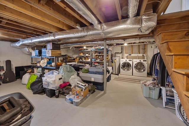 unfinished below grade area featuring washer and dryer and water heater