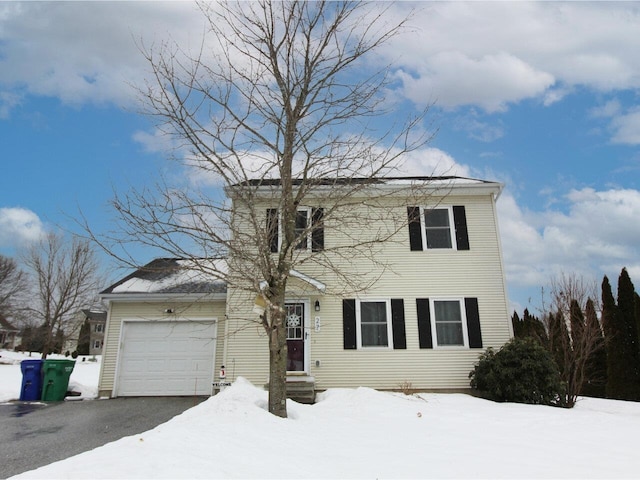 view of front of house with a garage and driveway