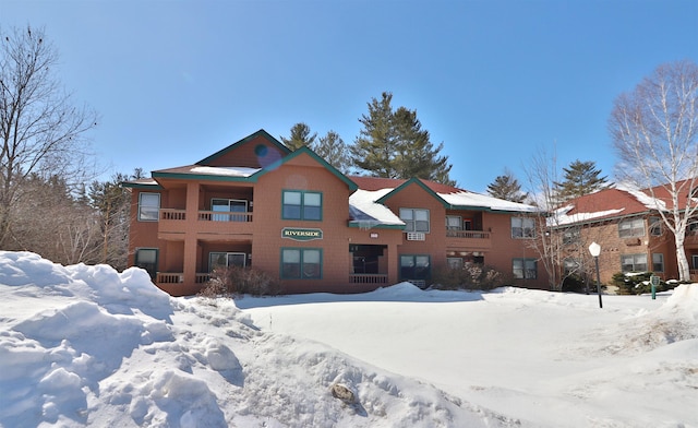 view of snow covered house