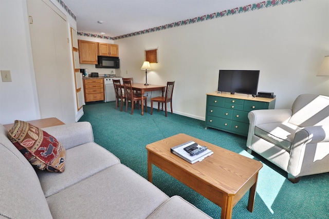 living area featuring dark carpet and baseboards