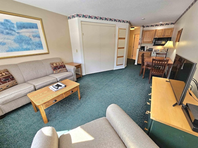 living room featuring dark carpet and a textured ceiling