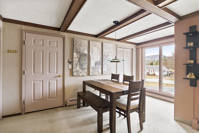 dining area with a baseboard radiator, beamed ceiling, light colored carpet, and a textured ceiling