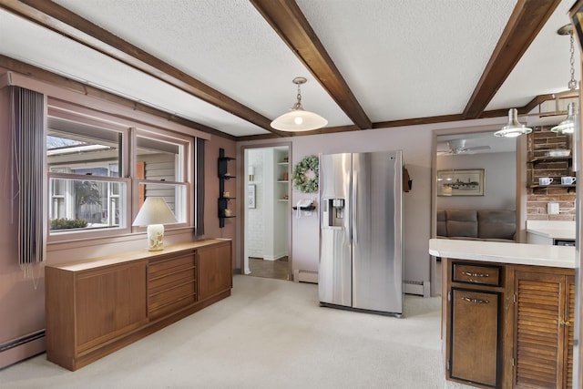 kitchen with a textured ceiling, stainless steel fridge with ice dispenser, light carpet, a baseboard heating unit, and beamed ceiling