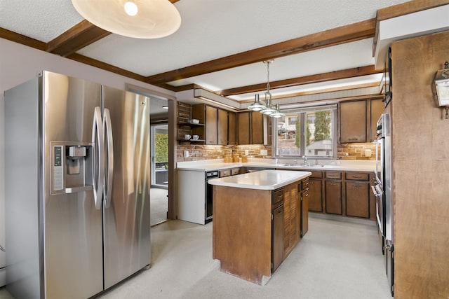 kitchen featuring stainless steel appliances, beam ceiling, a kitchen island, and decorative backsplash