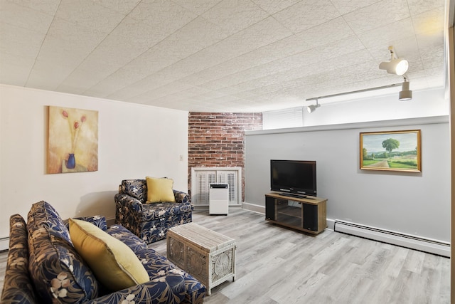 living room featuring wood finished floors and a baseboard radiator