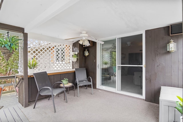 wooden deck with a ceiling fan